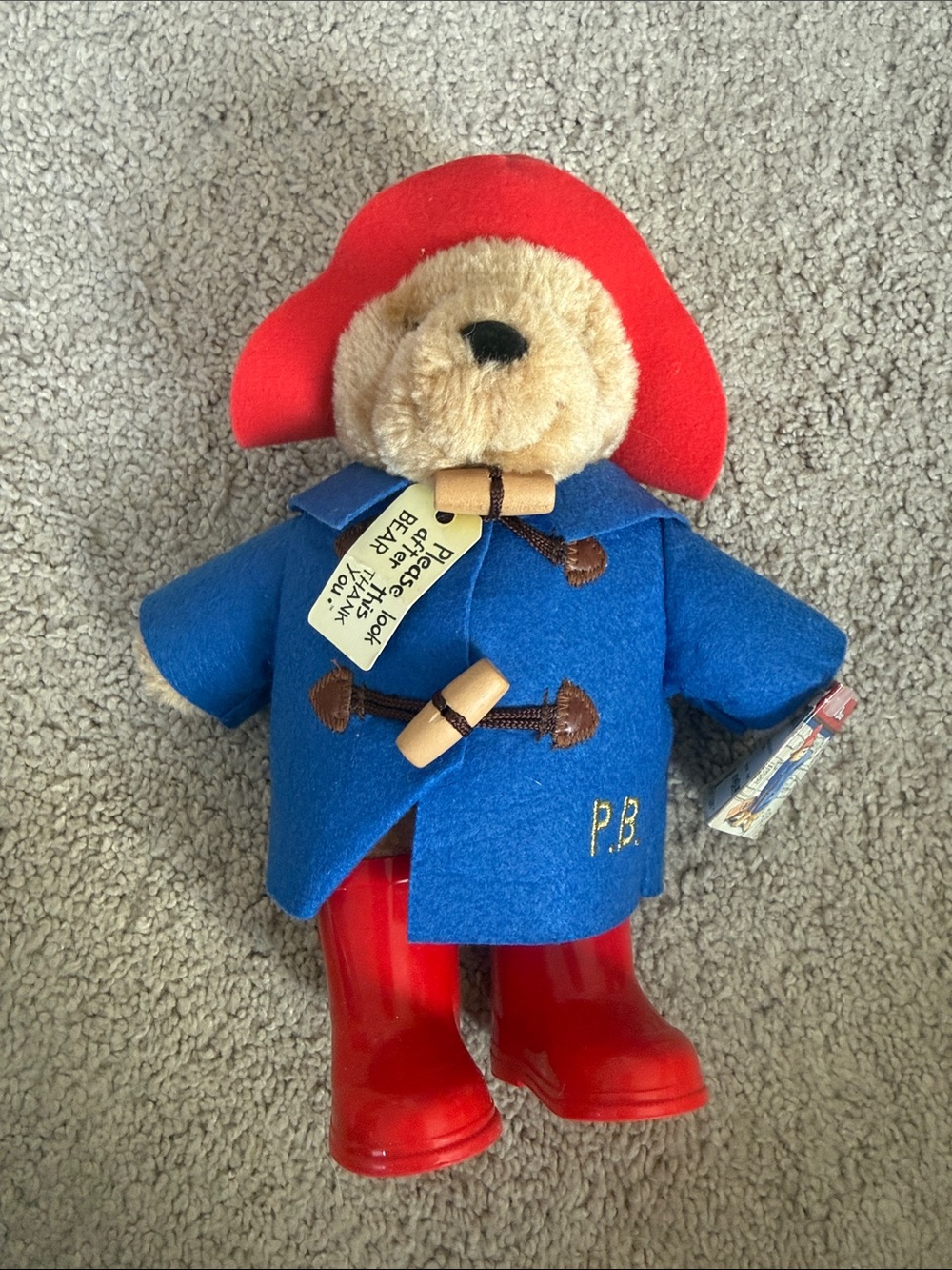 Retired Paddington Bear plush toy in blue coat and red boots 2011